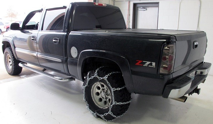 gmc-sierra-with-tire-chains-driver-paradise